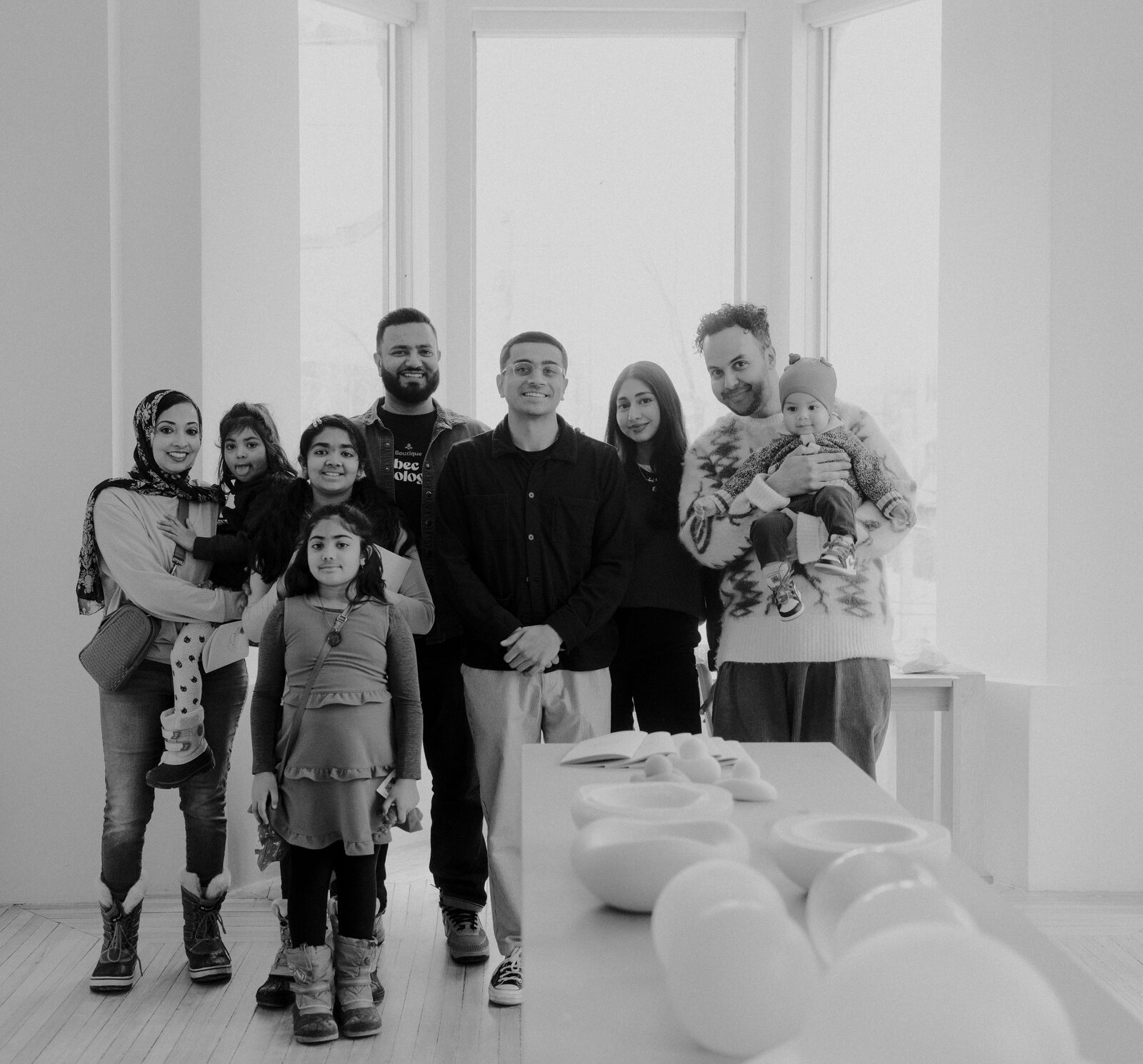 Visitors flipping through the Open Studio mini book