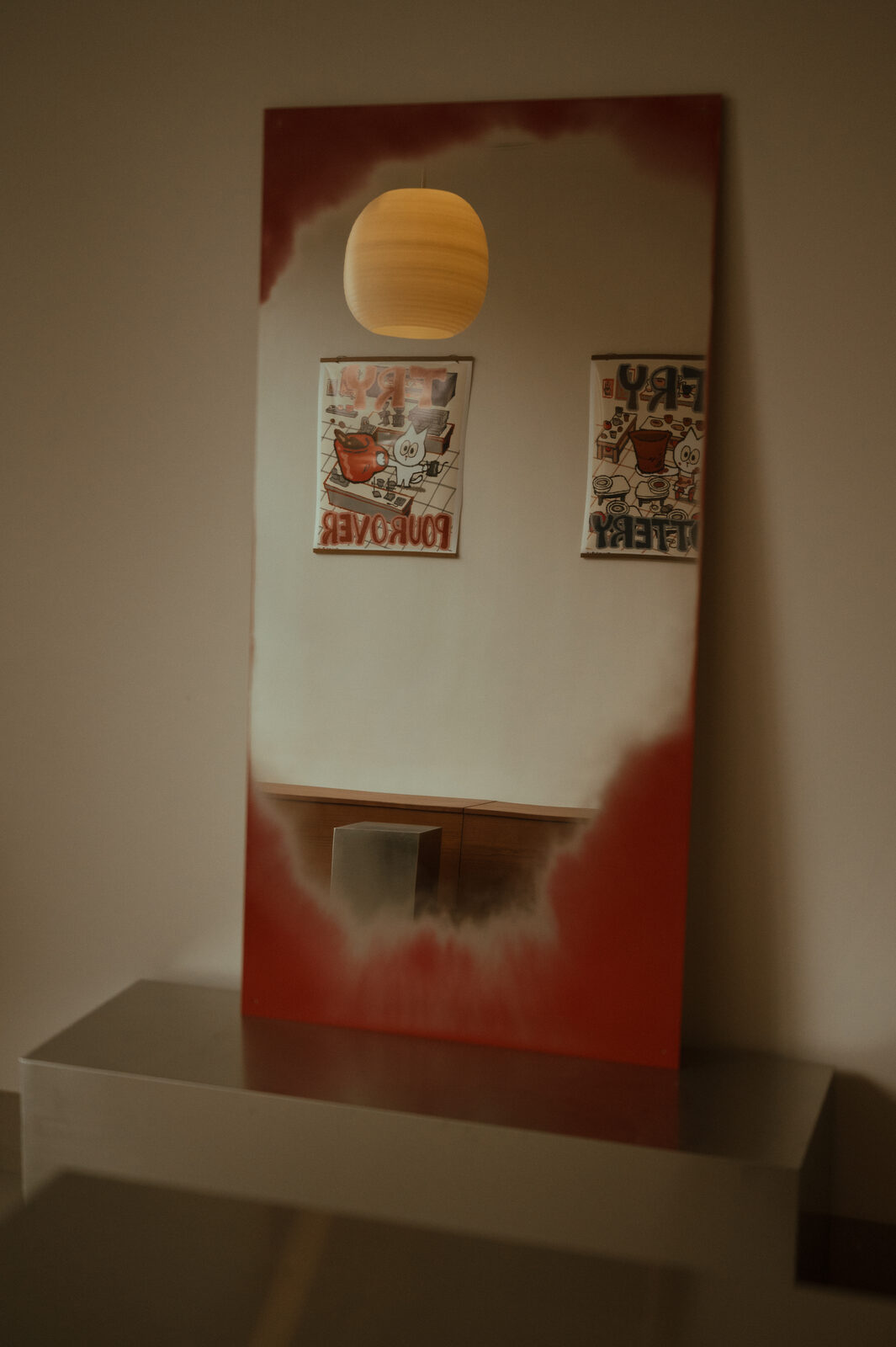 Tiger Baby Coffee and Clay signage reflected in a mirror